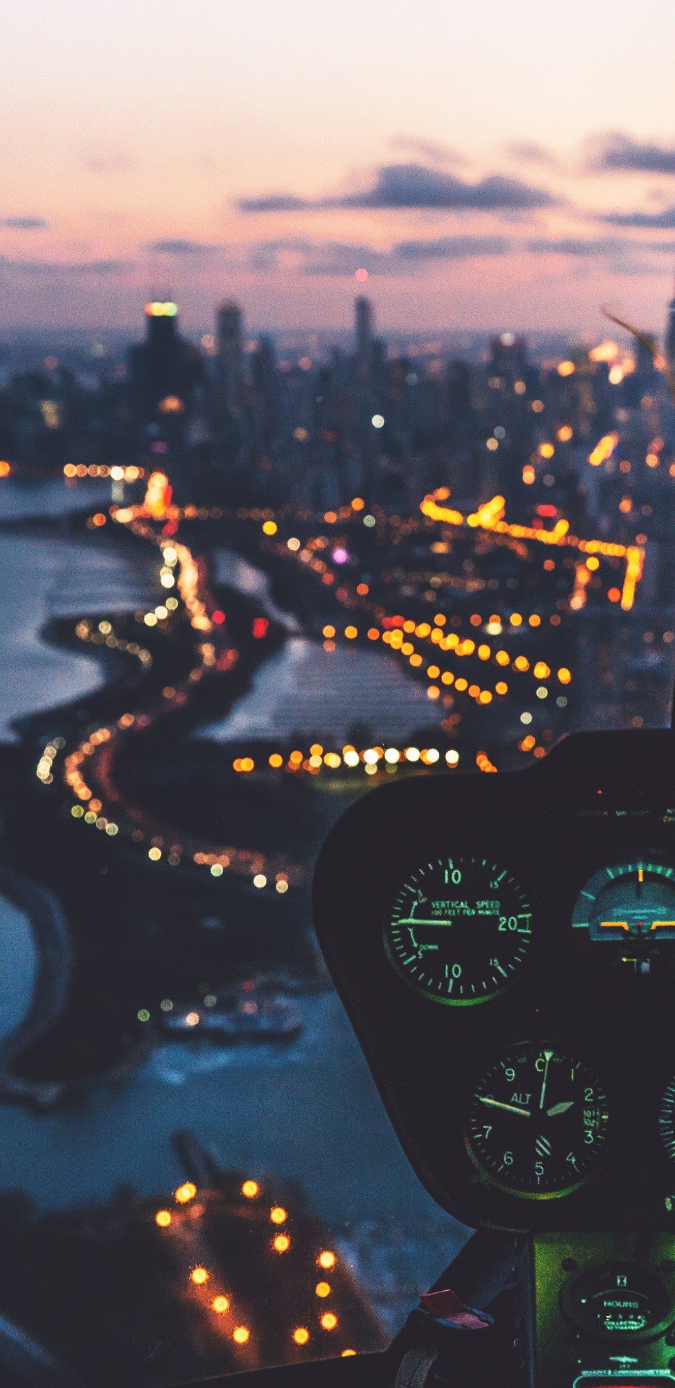 An aerial view of the city from the cockpit of a plane