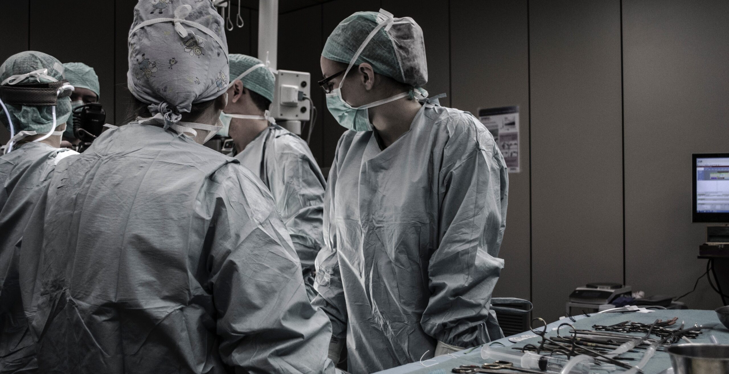 A medical student with doctors in an operating theatre
