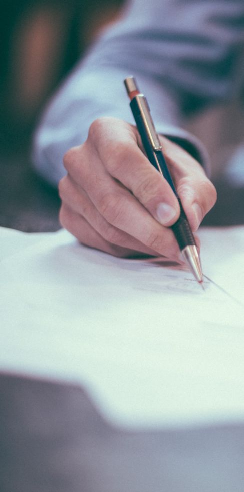 A person writing a resume A person writing a resume