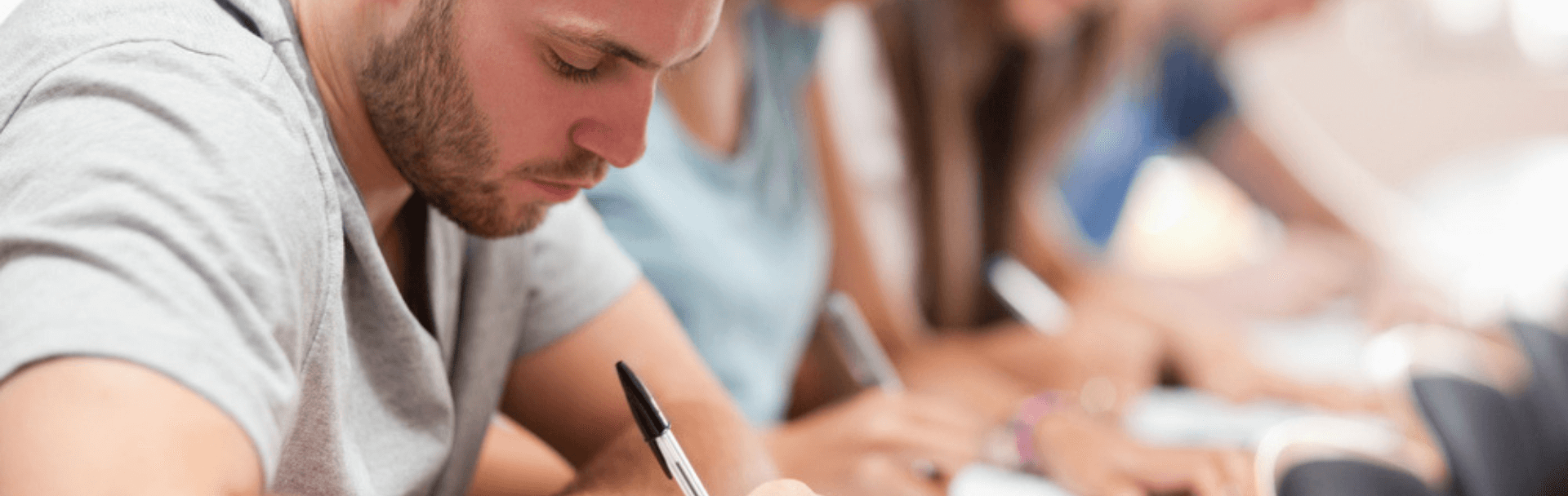 A law student taking notes in class