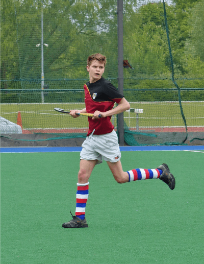 A student playing lacrosse at Cambridge University