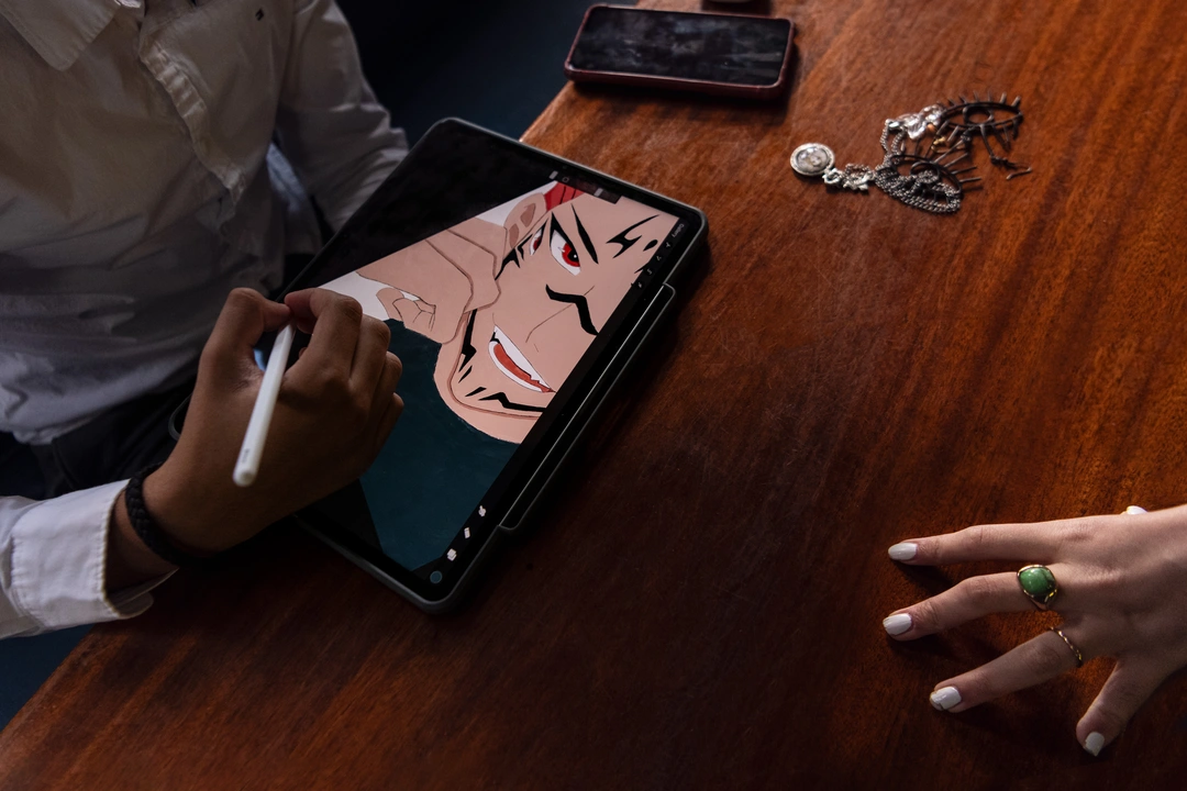 Student drawing on a tablet