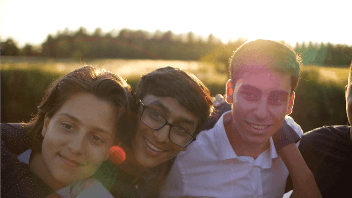 A group of young high school students celebrating their summer school graduation