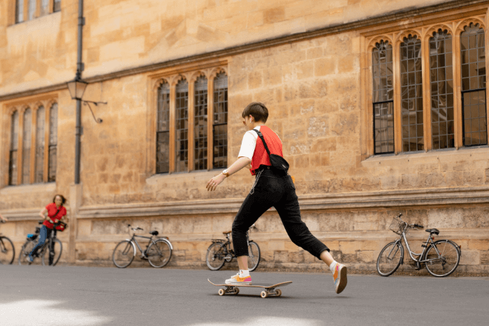 An international student skateboarding on the Oxford University campus An international student skateboarding on the Oxford University campus