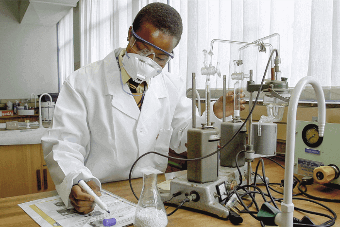 A young student studying science in a lab room