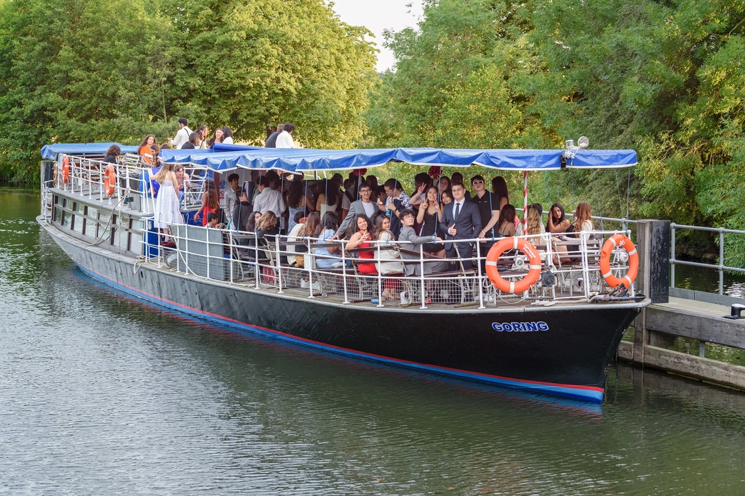 Students on a boat on the River Thames at Oxford Scholastica's International Boat Ball