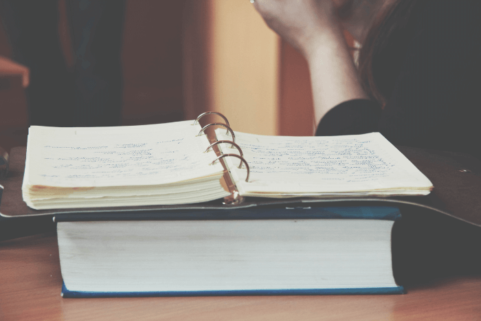 A student taking notes to become an academic writer