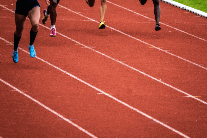 A group of runners doing whatever it takes to win