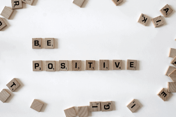 A sign showing a motivational quote, "Be Positive"