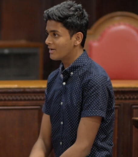 A high school student in a courtroom learning about law