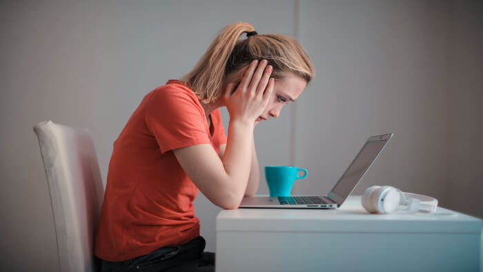 A young student getting a rejection letter from the universities and colleges she applied to