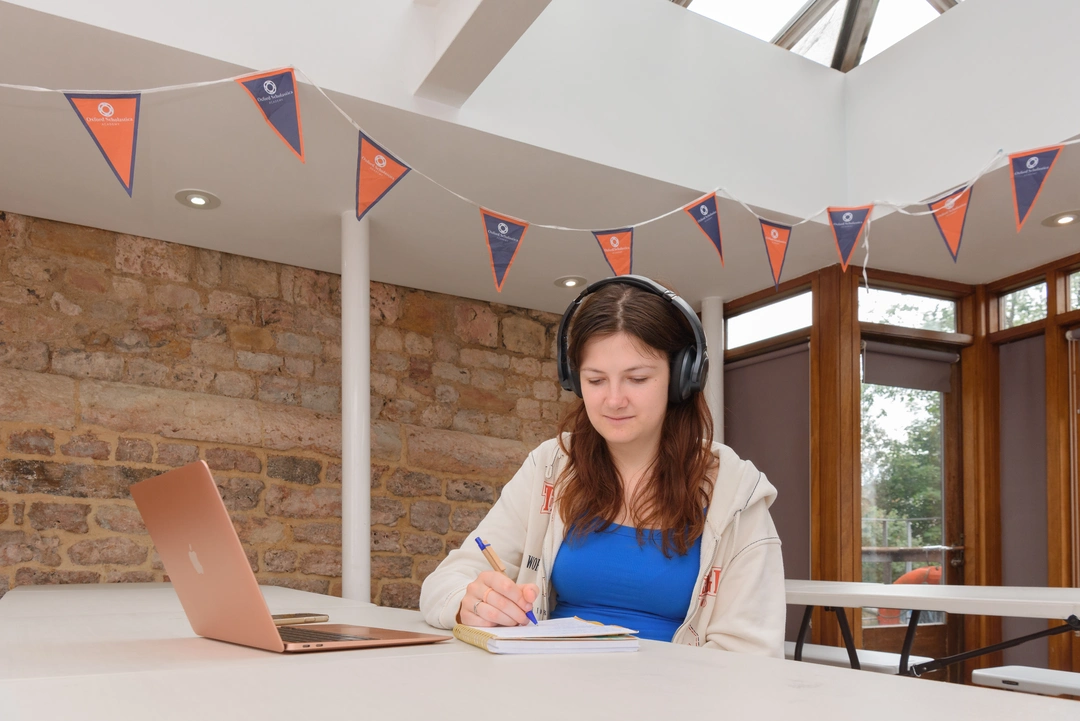 Oxford Scholastica student studying on their laptop