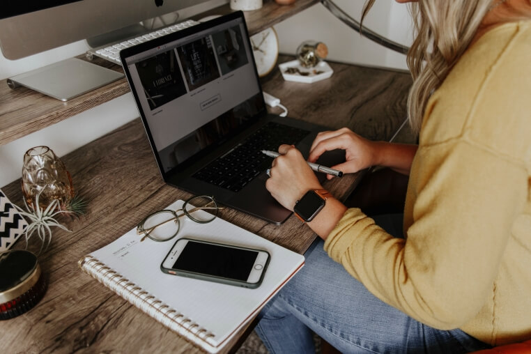 A young girl studying at home online