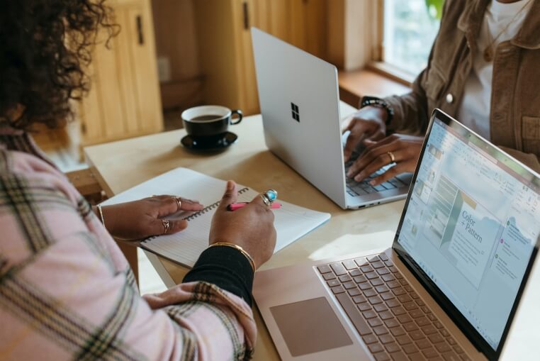 Two students working on a presentation for a virtual internship