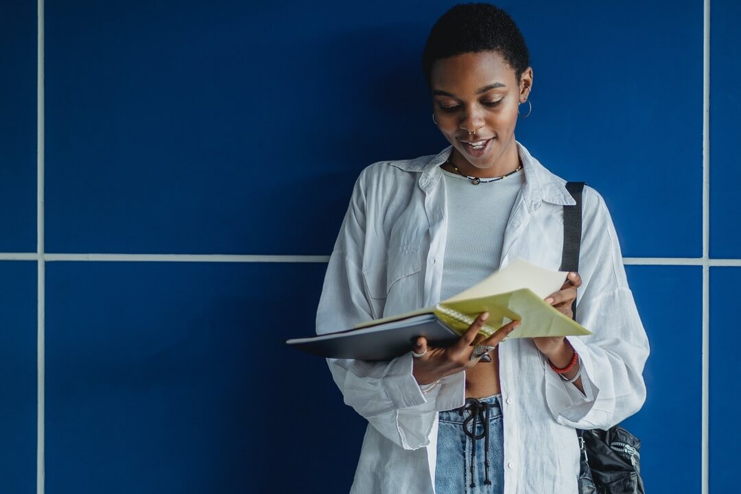 Student reading the LNAT preparation guide.