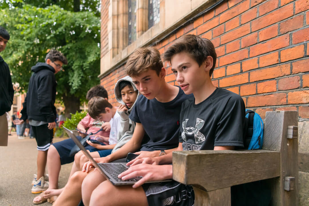 Oxford Scholastica international summer school students studying together outside