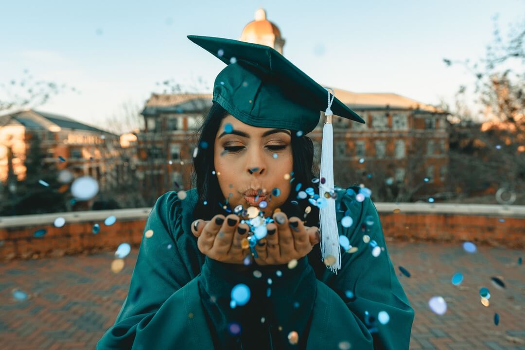 University student celebrating after interview.