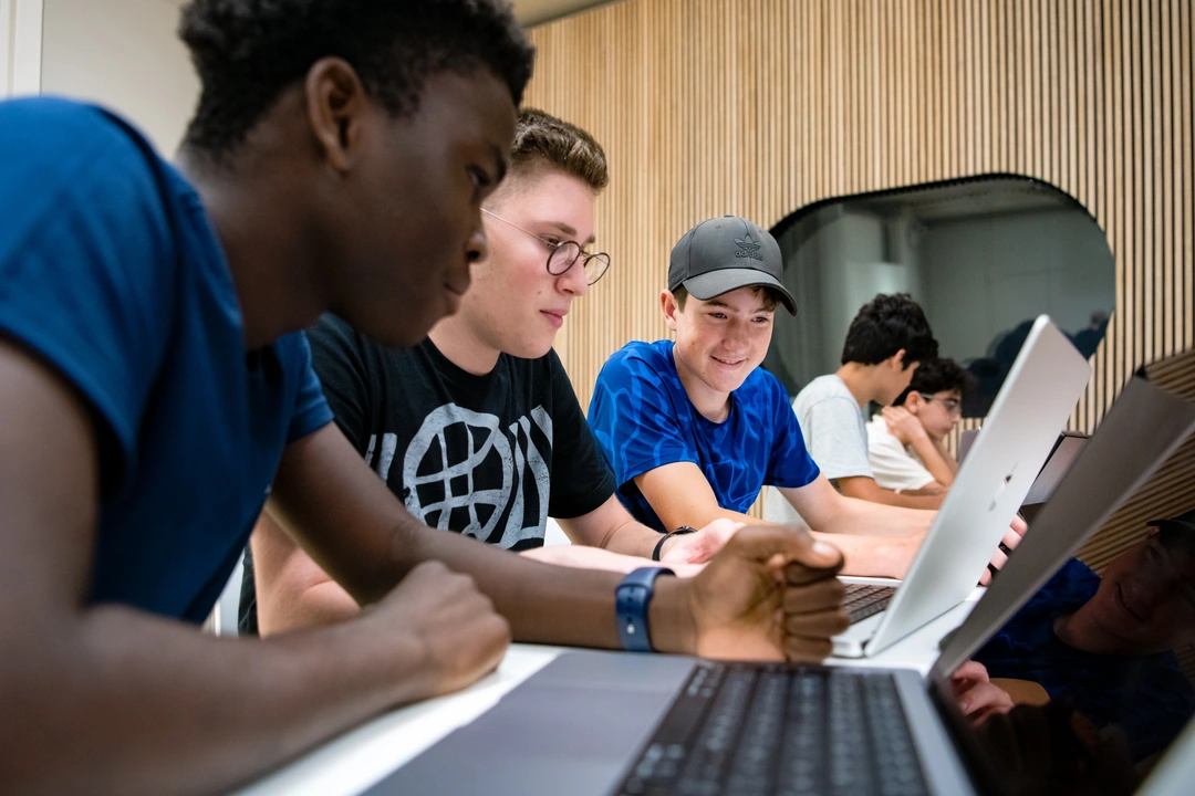 Three high school students collaborating