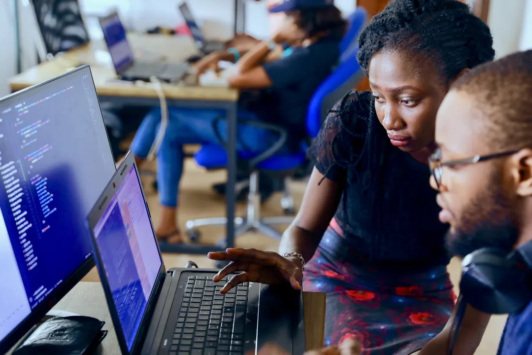 Two computer scientists working.