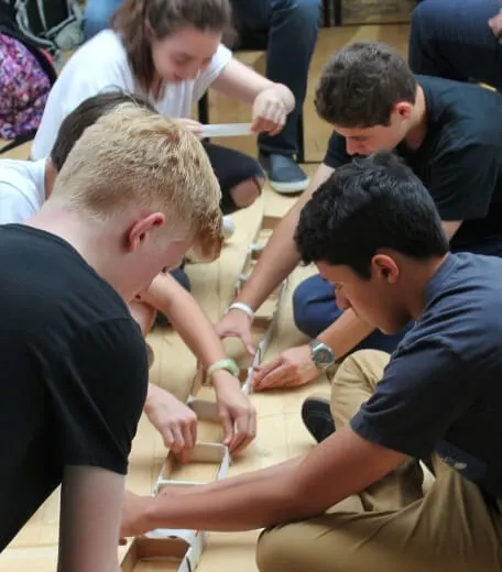 Students creating a model together during an Oxford Scholastica Engineering summer school.