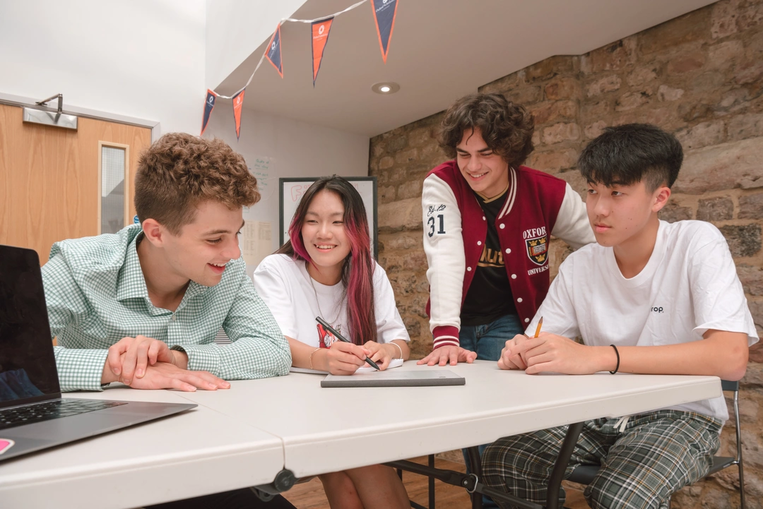 Oxford Scholastica students sitting around a table, deciding on their GCSEs