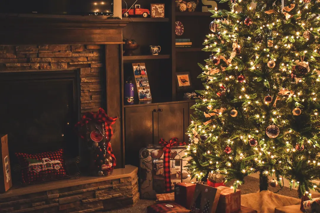 Decorated Christmas tree surrounded by presents 