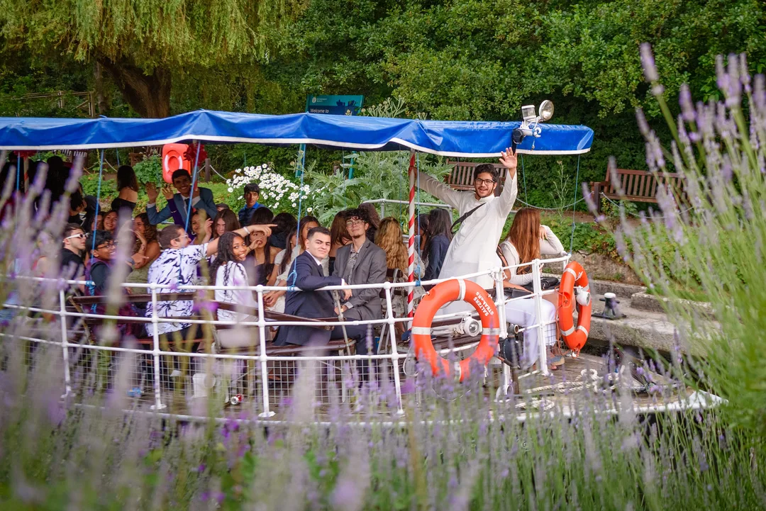 Group of students on a river boat for the Oxford Scholastica's International Boat Ball
