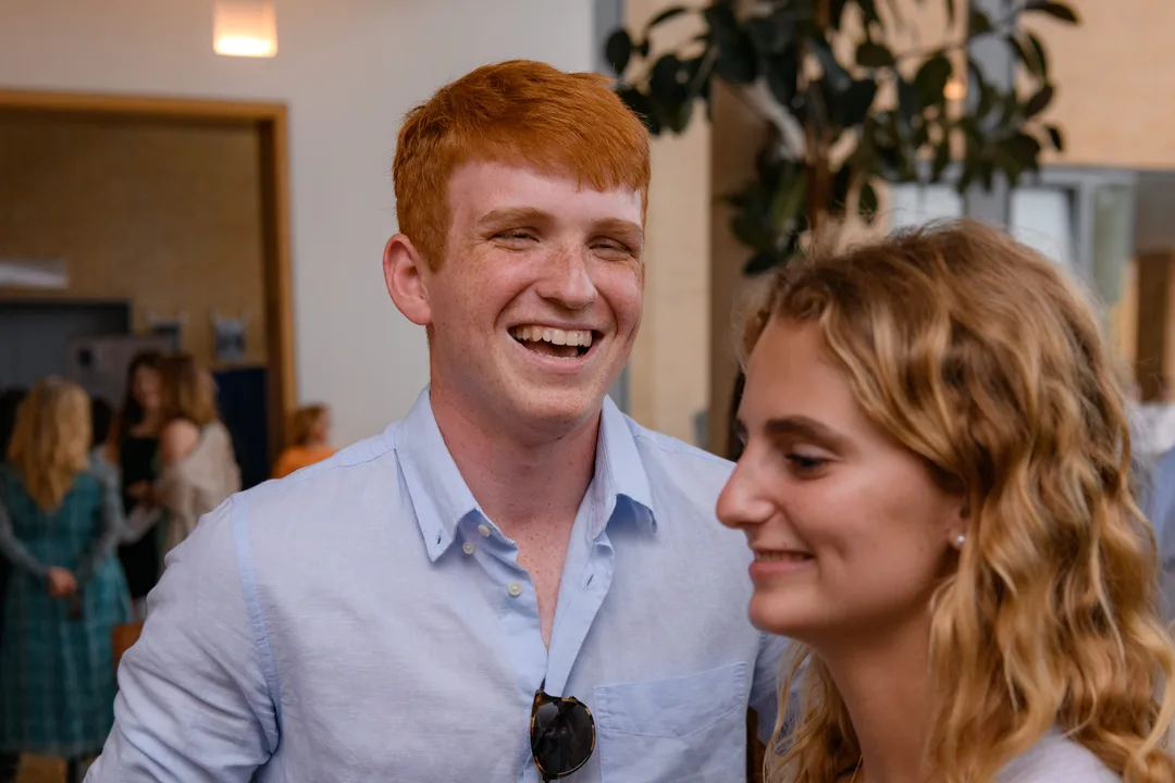 Two teenagers smiling and laughing