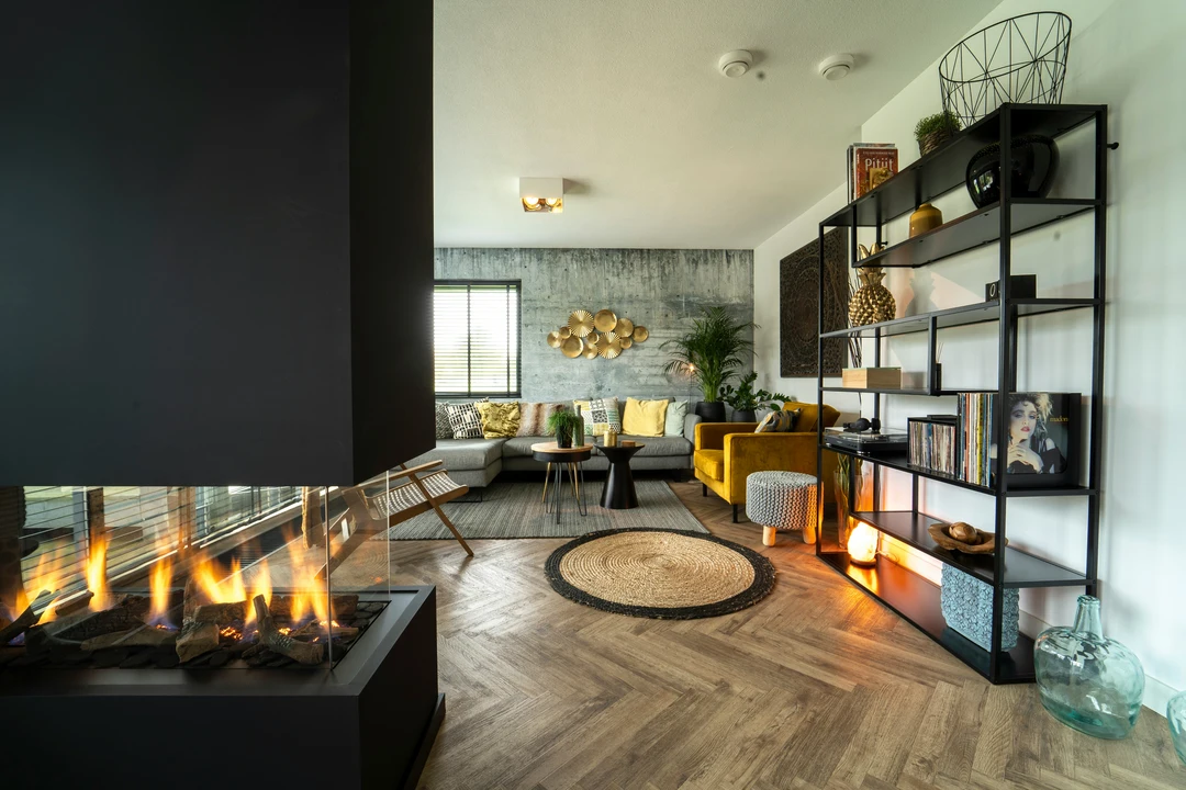 Interior of a modern lounge with a fireplace in the centre of the room