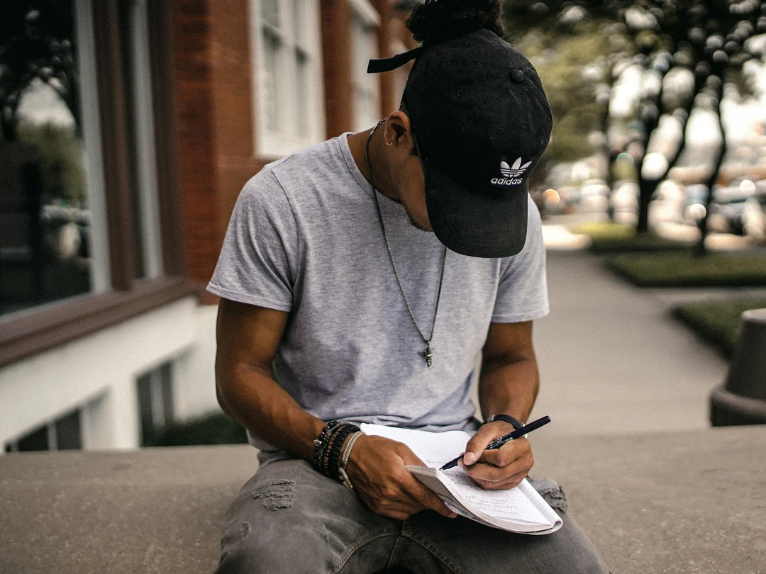 Student writing in a notebook