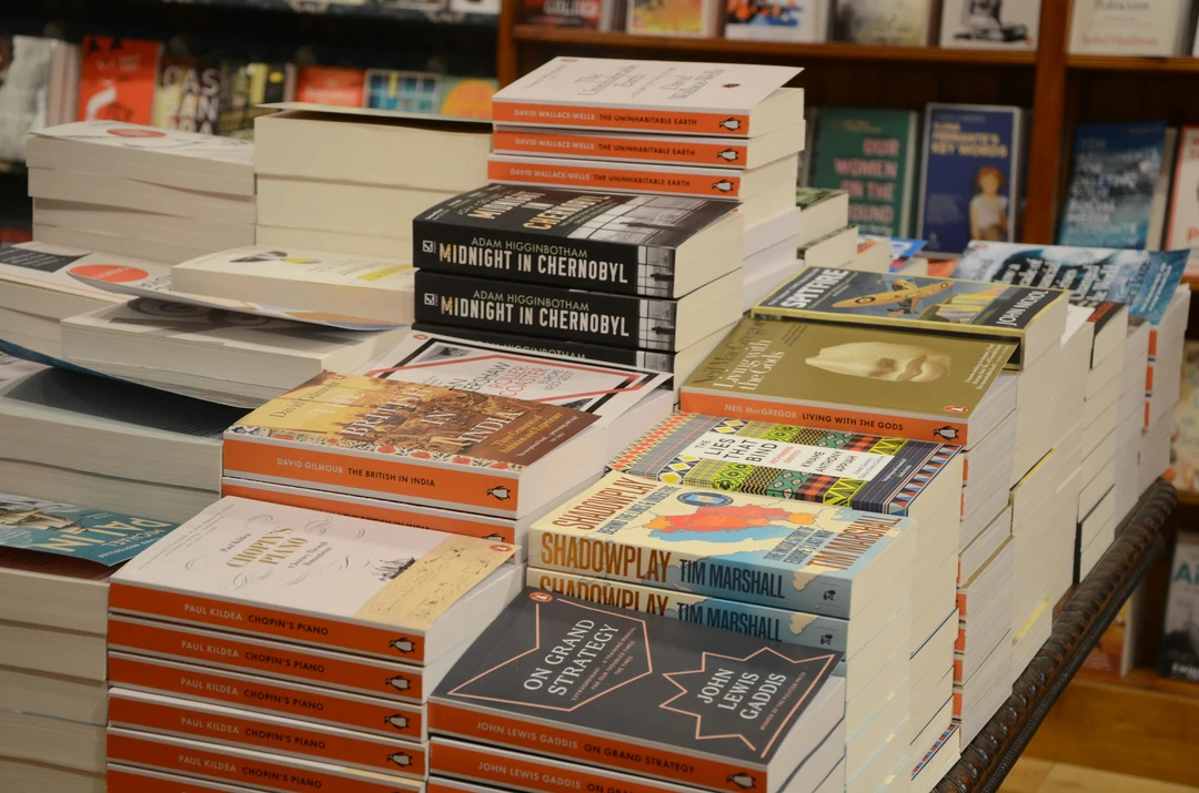 Stacks of non-fiction books in a bookstore