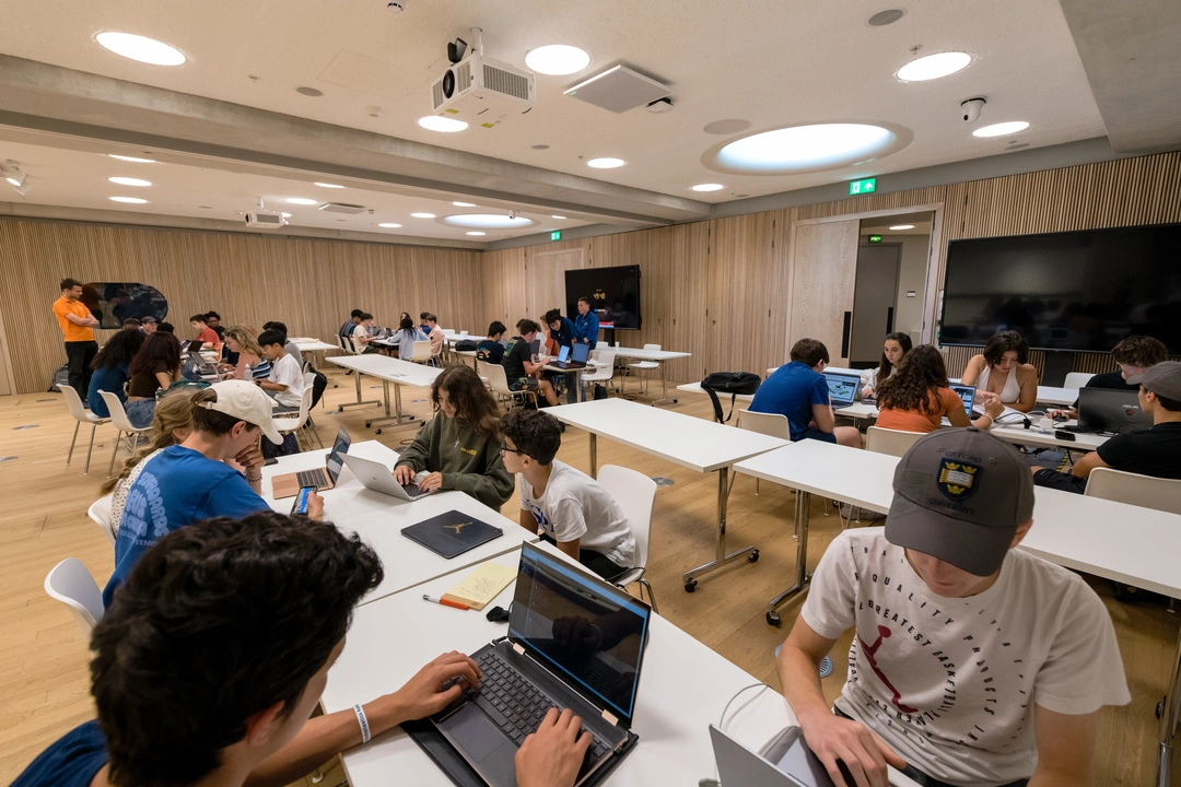 Wide shot of an Oxford Scholastica class of students working