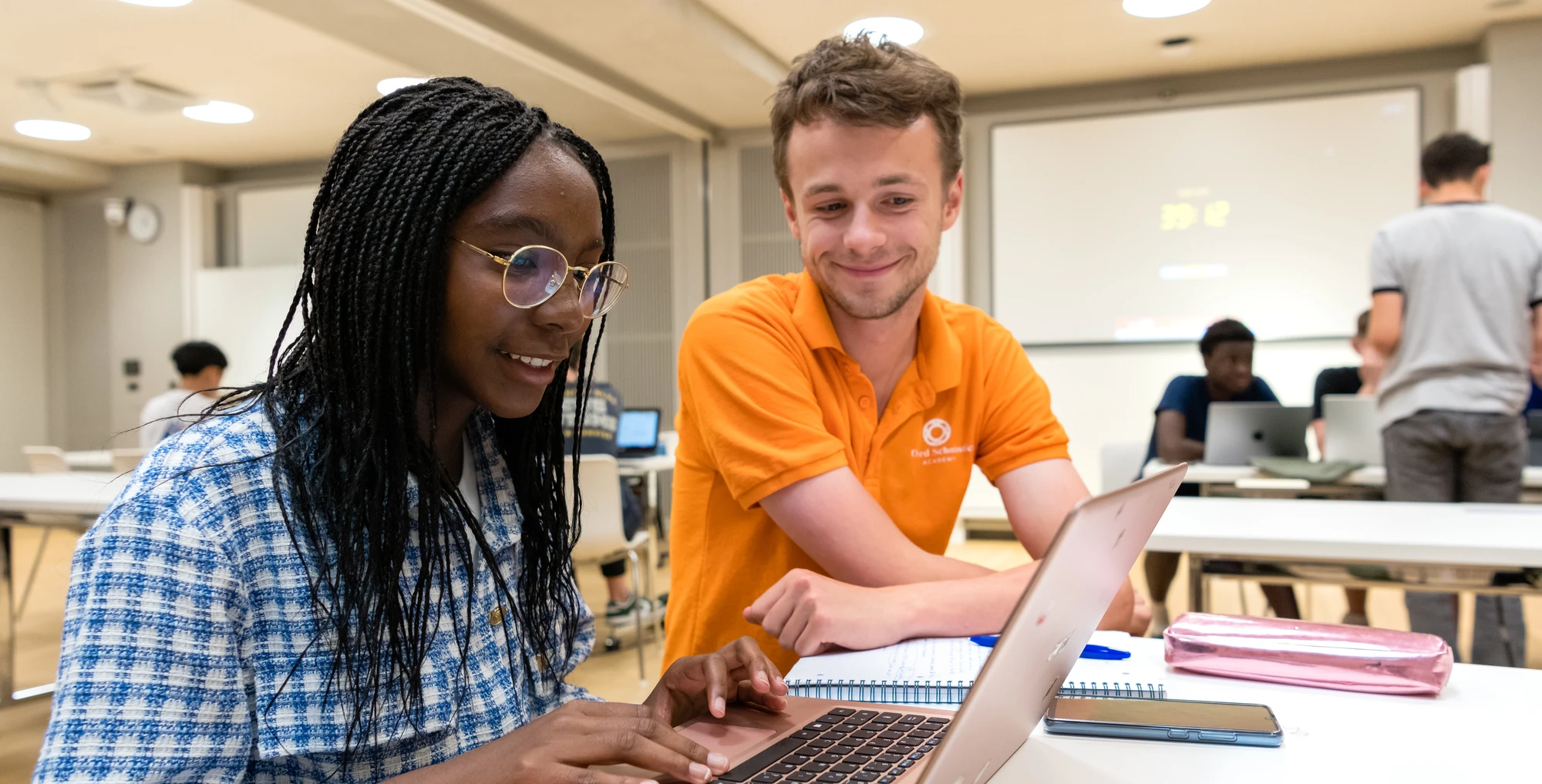 Oxford Scholastica student and mentor working together on a laptop